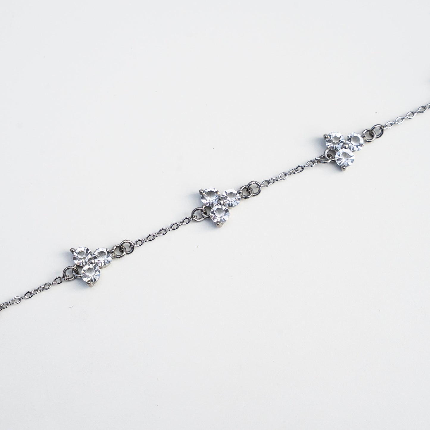 Silver bracelet with gemstones on a white background